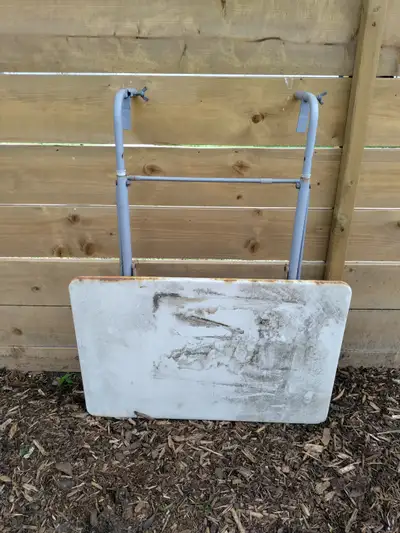 For use on a balcony or the fence of a deck. Needs a good clean or to be painted. The table surface...
