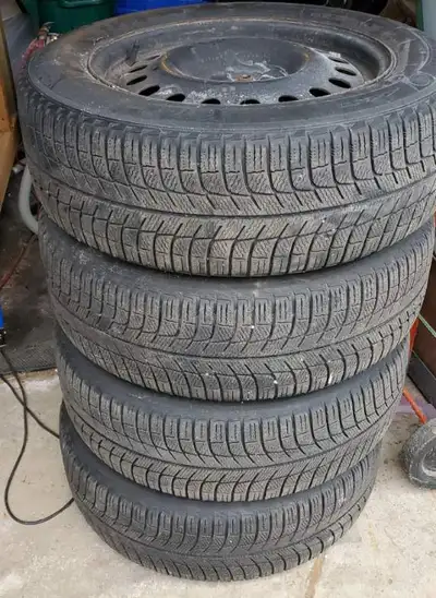 Set of 4 Michelin winter tires mounted on steel rims. Tread depth is good, with approximately 10/32n...