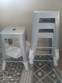 Four 24 inch silver stools