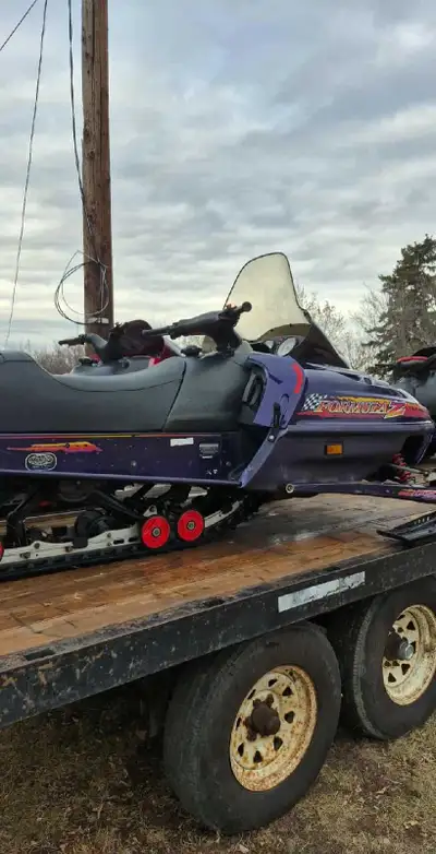 3045 kms new seat cover, fuel pump. Heated grips. Track and slides are excellent.