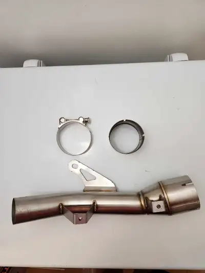 New/Unused Midpipe for breadbox delete. Includes clamp and additional flange for welding to breadbox...