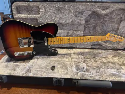 A fantastic example of a telecaster ultra with a body wrapped in binding, compound radius neck, nois...