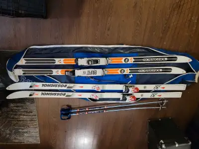2 sets of skis 1 set of skis poles and carry bag., View more
