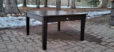 Square IKEA coffee table, "Markör" style, solid wood, espresso colour. Has two drawers with cup pull...