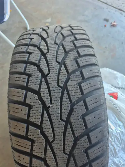 Set of 4 Uniroyal Tiger Paw Ice and Snow 3 snow tires on rims in excellent condition ready to instal...