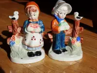 A Pair of Midcentury ceramic   Boy and Girl Figurines