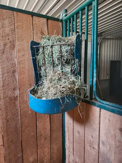 This is a sturdy used box stall hay feeder designed to help manage hay consumption and reduce waste....
