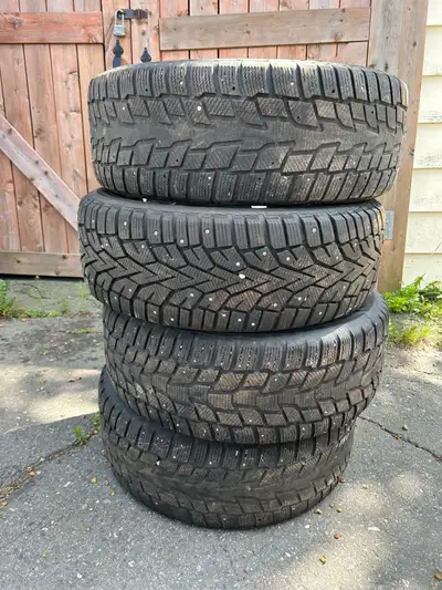 4x winter tires on rims, was on a 2016 toyota rav 4 All hold air Studded 235/55R18