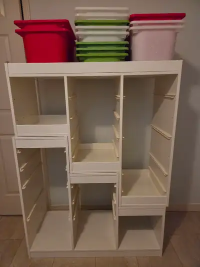 2 white storage units, with baskets(multi coloured), side by side storage; multi purpose units