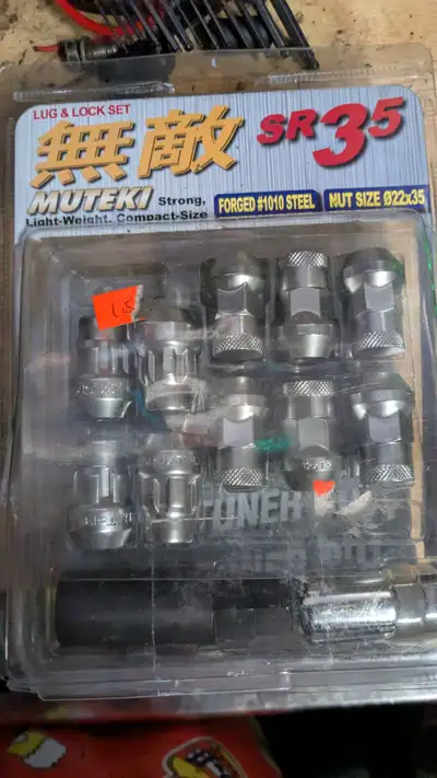 Up for sale is a a new in box set of Muteki lug nuts in silver. Comes with lock nuts and the appropr...