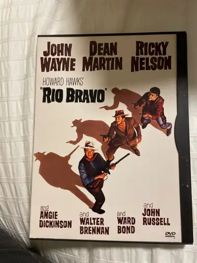 Own a piece of classic cinema with the Rio Bravo DVD, starring John Wayne, Dean Martin, and Ricky Ne...