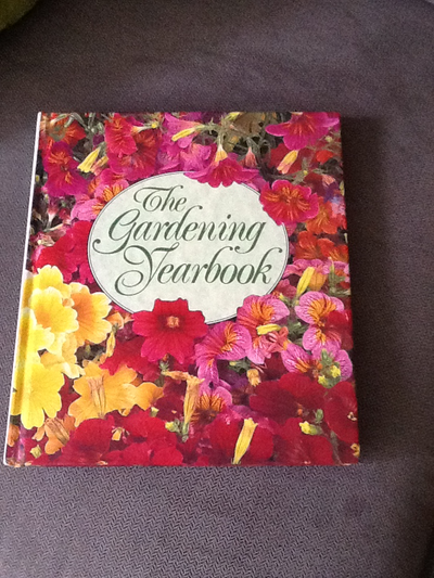 THE GARDENING YEARBOOK and one pair of gardening gloves, View more