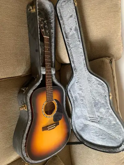 Simon & Patrick SongSmith acoustic guitar., View more