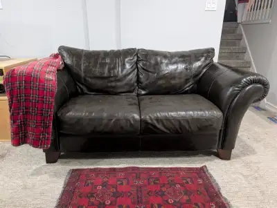 Brown leather loveseat from Mobilia, View more