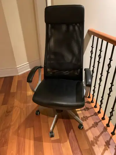 This is an Ikea Markus chair that offers excellent support for long hours at your desk. The high bac...