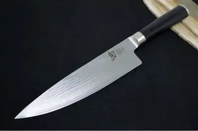 The Shun Classic 8-in. Chef's Knife is part of the Shun Classic line of tasteful and contemporary cu...