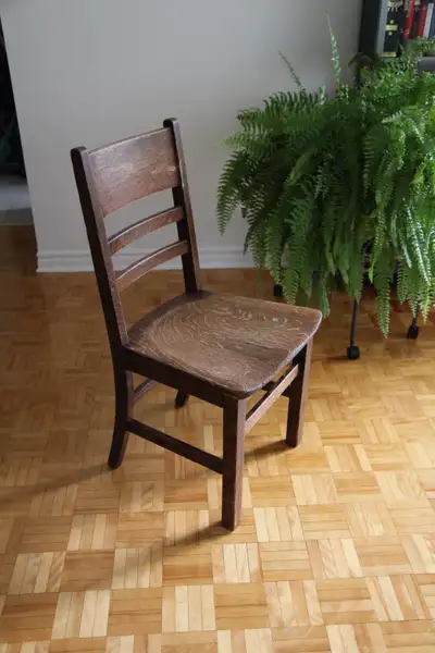 Antique solid oak chair from the early 1900s. Was primarily used in a seamstress shop then in a home...