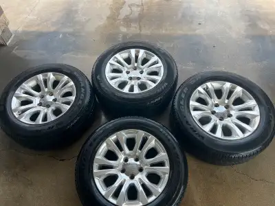 For sale is a set of four 20-inch Laramie Longhorn edition wheels paired with Goodyear Wrangler tire...