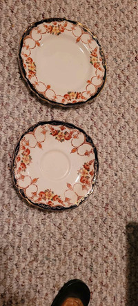 Tea cup and saucer and two saucers
