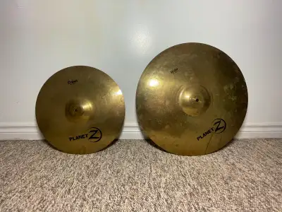 For sale is a set of Zildjian Planet Z cymbals, including a crash and a ride cymbal, perfect for beg...