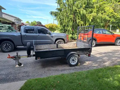 Great condition 4x8 utility trailer with ramp and wheel jack for sale. 2 inch hitch, newer tires wit...