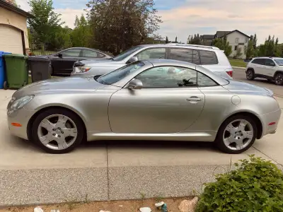Feast your eyes on this stunning 2005 Lexus SC430, a hardtop convertible that blends luxury with per...