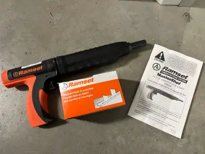 This Ramset MasterShot powder fastening system tool attaches track to concrete. It's designed for lo...