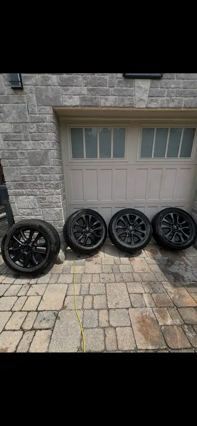 Authentic OEM Jeep Grand Cherokee wheel package, rims and tires with tire pressure sensors Like new...