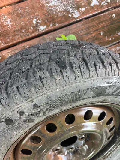 These pre-owned motomasterTotal Terrain 225/65R17 winter tires mounted on metal rims are designed to...