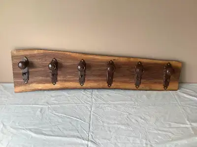 Unique hand crafted antique door knob coat rack set on beautiful Black Walnut. The door knobs come w...