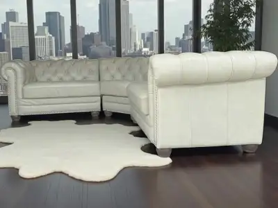 Excellent condition top grain leather sectional. Chesterfield style with button tufting. 100% leathe...