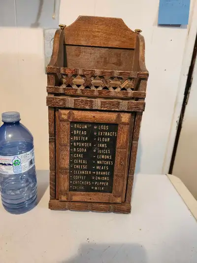 This vintage wall box features a charming, rustic design with a chalkboard front for shopping lists...