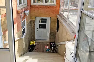 2 bedroom 1 den Walkup Basement apartment from August 1