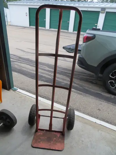 Trolly cart will need tire in future holds air good now. all sold together or text for info 780 996...