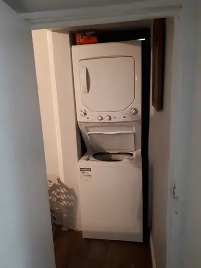 Stacked GE washer and dryer, View more