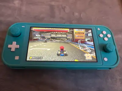 Nintendo Switch lite with MarioKart 8 +128GB card + case, View more