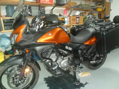 Second Owner Givi engine guards, pannier racks , top box plate and Air Flow windshield Pelican cases...