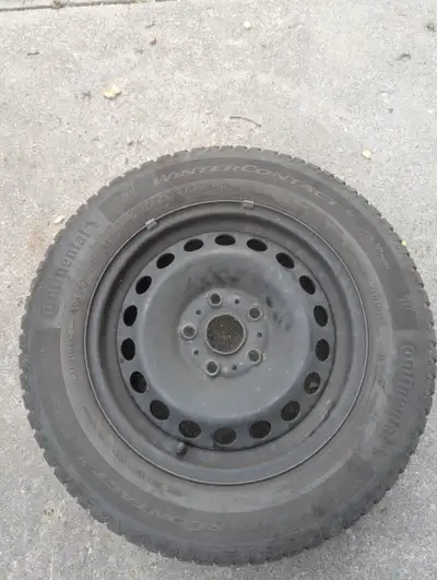 4 Continental WinterContact SI winter tires mounted on steel rims, sized 195/65 R15. These tires are...