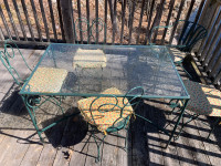 Antique wrought iron glass table and chairs