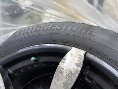 I'm selling a set of four Bridgestone Blizzak WS90 winter tires, size 235/60R17, mounted on alloy ri...