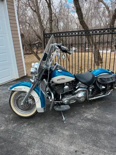 Classic Harley Davidson, 88 cubic inch, windshield, leather saddlebags, good rubber, 2 seats. Price...