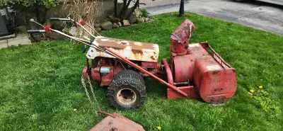 This Gravely Dually two-wheel tractor is a robust machine ready for various tasks, though it shows i...