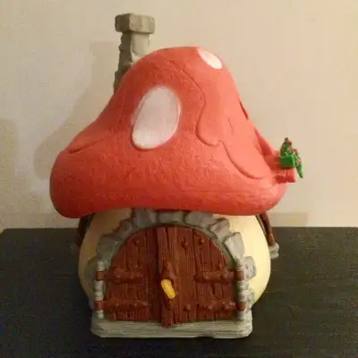 This is a wonderful vintage Smurf large mushroom house. The windows are intact and it even has the k...