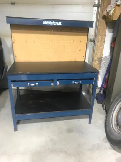 Workbench For Sale. 48 inches long. Peg Board and wooden working surface. Top shelf. 2 slide - out d...