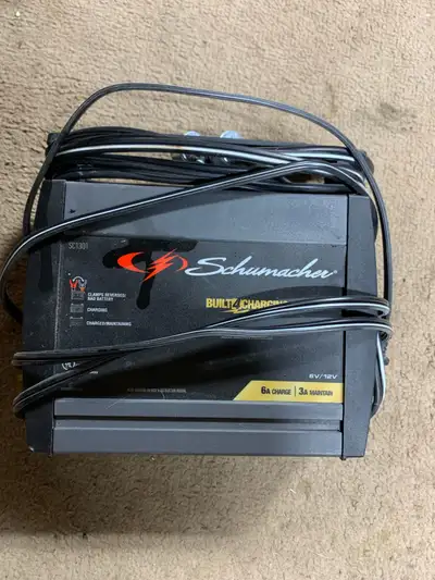 This is a Schumacher SC1301 6/12V 6A battery charger and 3A maintainer, perfect for keeping your bat...