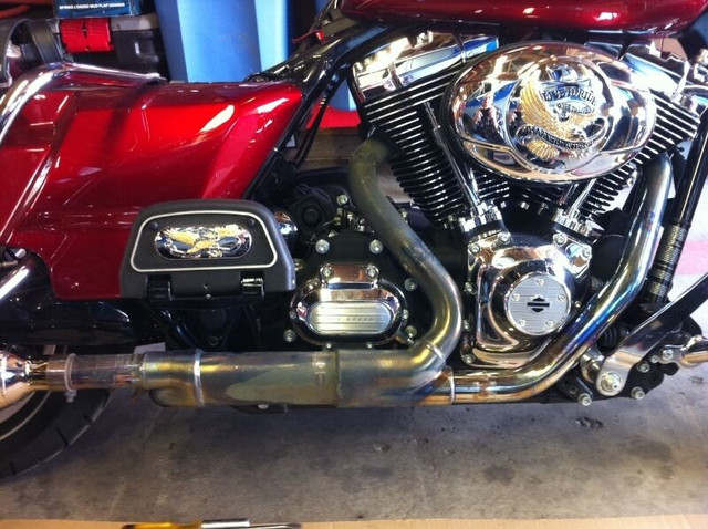 Full Factory Exhaust from a 2013 Harley Davidson Roadking in Sport Touring in Edmonton