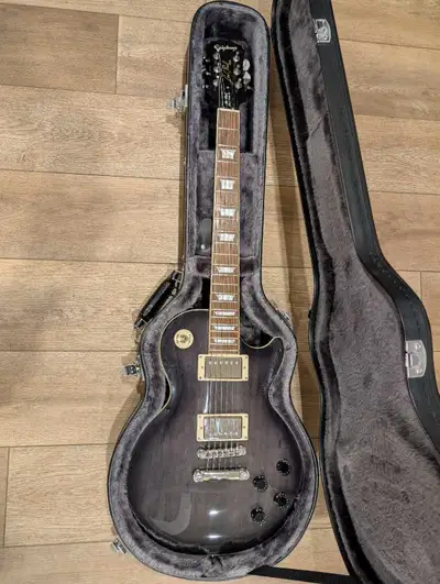 Mint condition Epiphone Les Paul Tribute from 2010 in a beautiful Transparent Black finish. This gui...