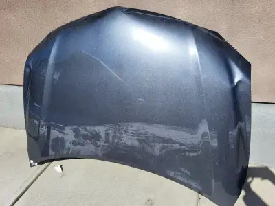 2011 Toyota Camry hood with minor damage. $25.00. For more info please contact 403-370-4336