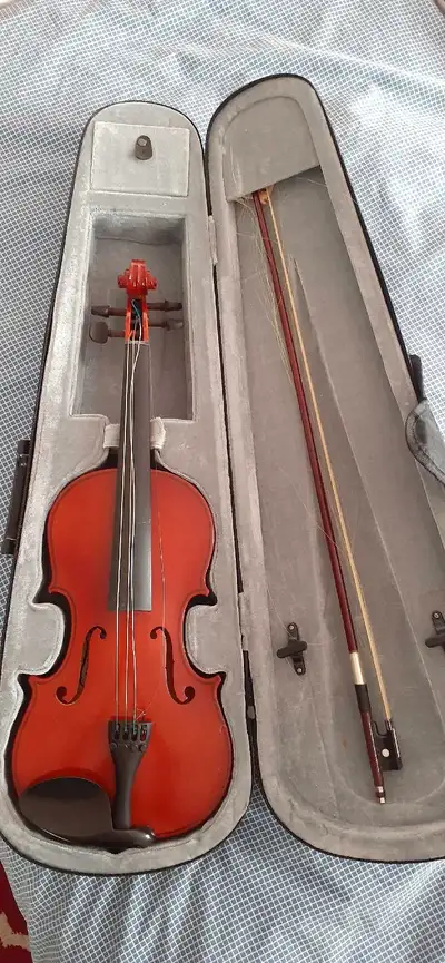 This is a vintage Madera Violin in original case with bow and resin. Bow could be re-haired & string...