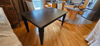 Ashley solid wood dining table. 63 inches x 39 inches